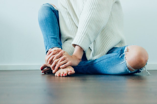 Acupuncture: Woman sitting on the floor