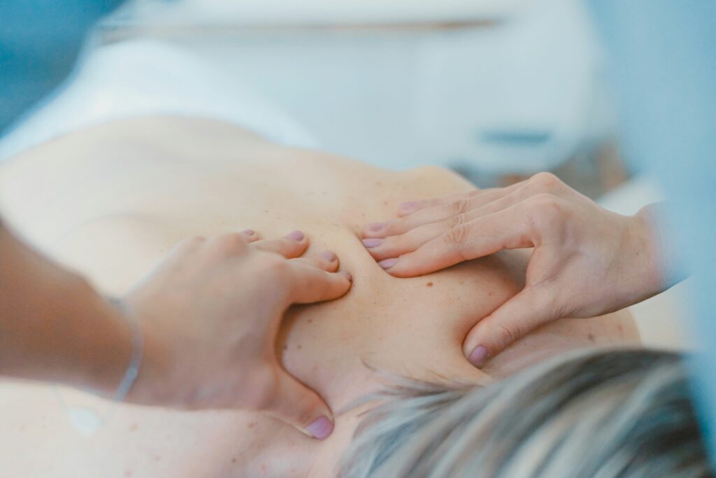 Hands massaging a patient